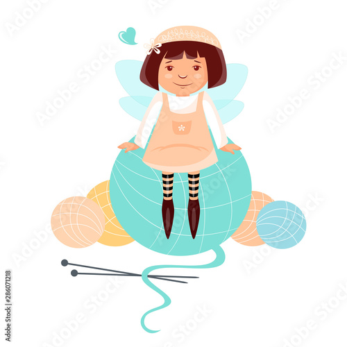girl sitting on a ball of knitting thread
