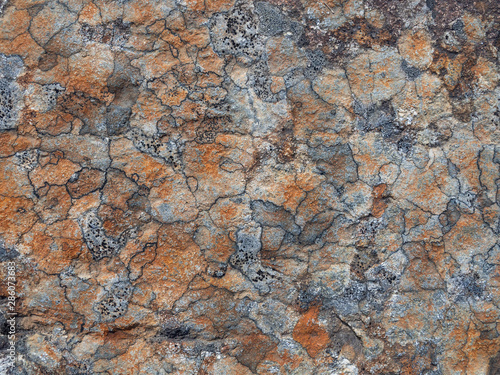 Flat stone surface with a different color pattern. Rock stone background