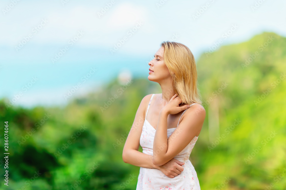 Closeup portrait of happy woman with closed eyes tanding at summer tropical island background. Closeup portrait of happy woman with closed eyes tanding at summer tropical island background.
