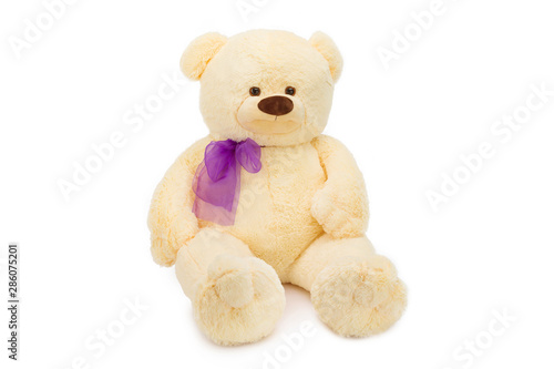Image of golden toy teddy bear sitting at isolated white background. © Mayatnikstudio