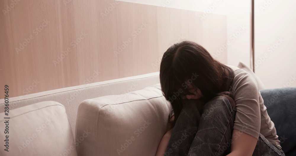 woman feel depressed on sofa woman feel depressed on sofa