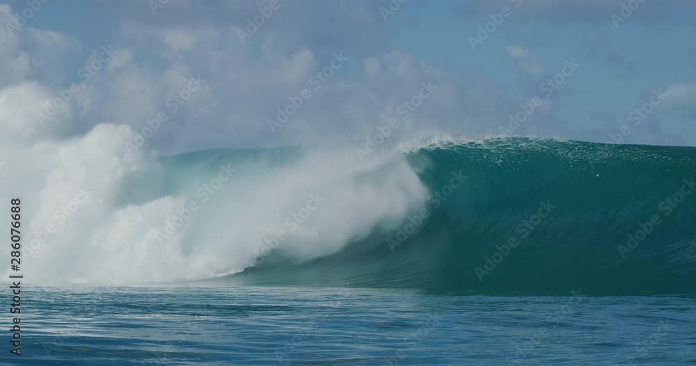 Huge powerful barreling ocean wave spits and sprays in slow motion, most epic waves on the planet Huge powerful barreling ocean wave spits and sprays in slow motion, most epic waves on the planet