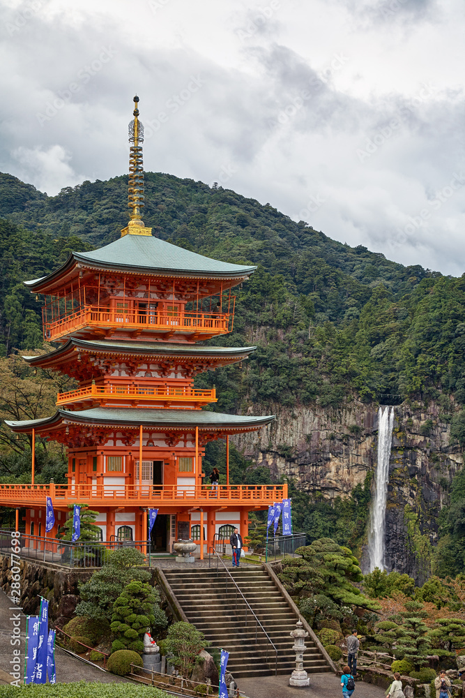 Three Story Pagoda of Seigantoji Temple with the Nachi fall on the background. Wakayama. Japan. Three Story Pagoda of Seigantoji Temple with the Nachi fall on the background. Wakayama. Japan.