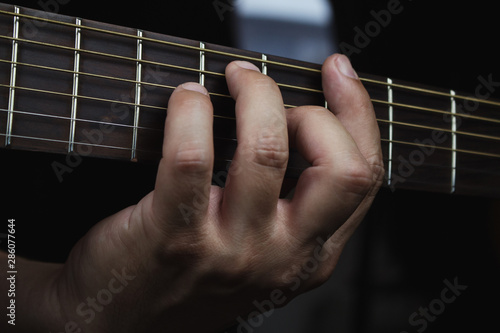 Acoustic Guitar Player Performing. Guitarist Playing In Music Studio