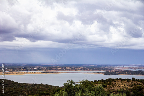 view of alqueva dam. artificial lake © celso claro