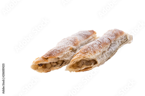 delicious strudel apple pie with nuts isolated on white background