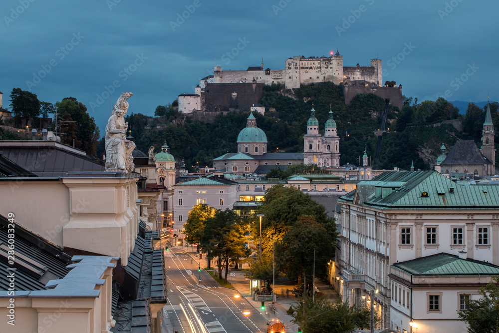 high angle viiew of Salzburg city with cathedral and caste at sunset