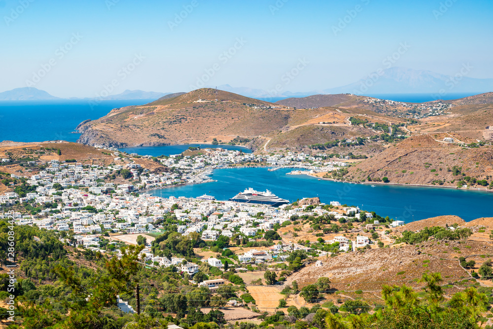 Landscape view of Skala harbor and town, Patmos Island, Greece.