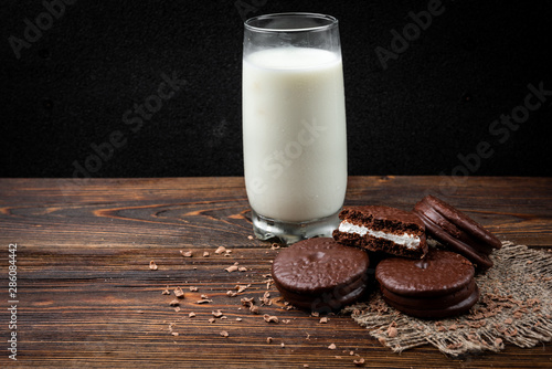Chocolate cookies on dark wooden background. Chocolate pie.