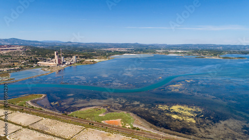 Aerial photo of a cement factory along the Berre lake in Port La Nouvelle