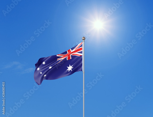 3D illustration. Colored waving flag of Australia on sunny blue sky background.