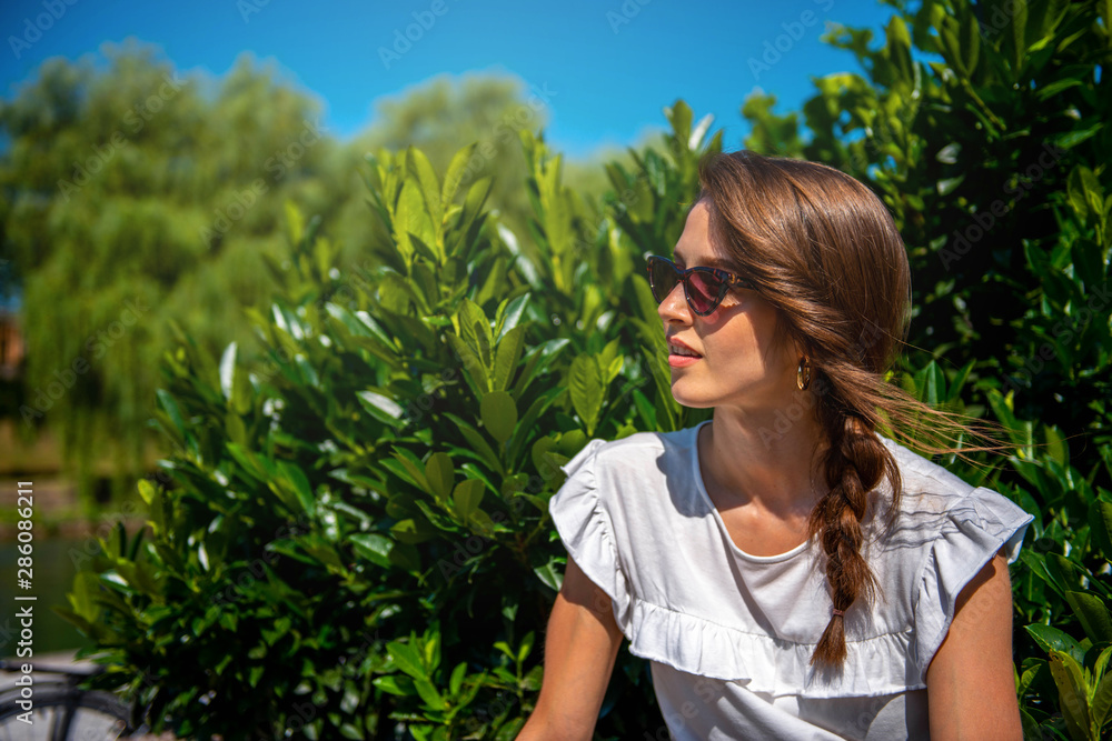 Young woman with sunglasses in the Park Young woman with sunglasses in the Park
