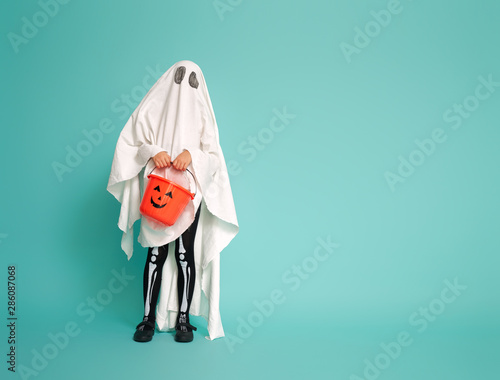 kid in ghost costume