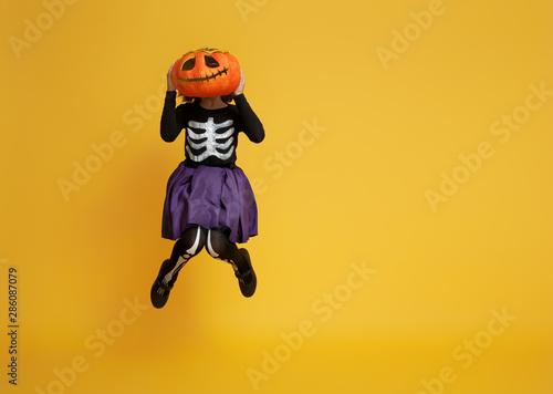 little girl in skeleton costume