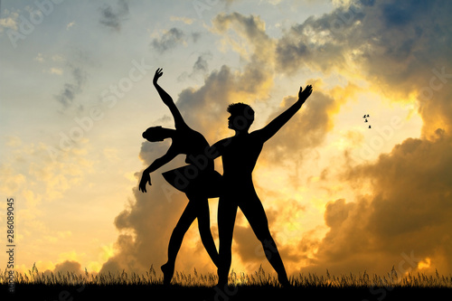 ballet dancers couple at sunset