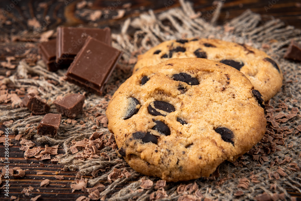 Cookies with chocolate on dark wooden background. Cookies with chocolate on dark wooden background.