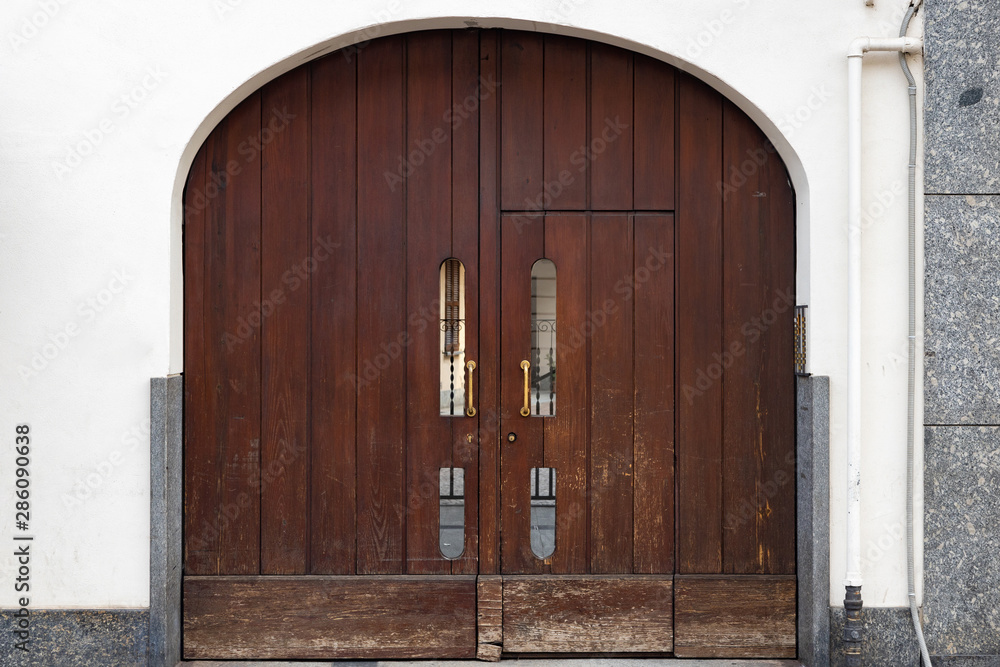 wooden arched door Monza, Italy