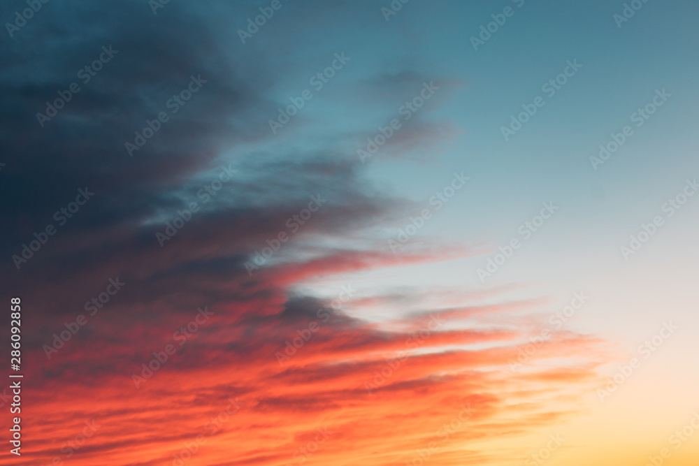 Beautiful sunset sunrise sky with pink orange and dark clouds. sky with colorful clouds