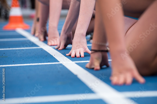 Blue running track. Lanes of a athletic track with numbers. Blue running track in stadium. rubber running tracks in outdoor stadium. Sports Track, Blue, Starting Line