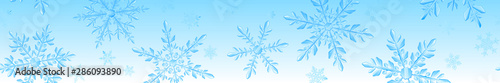Christmas banner of large complex transparent snowflakes in light blue colors on gradient background. With horizontal repeating pattern. Transparency only in vector format