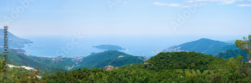 View of Boko Kotor on the background of mountains with clouds in the sky on a cloudy day.