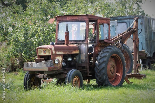 Rusty old tractor in a field