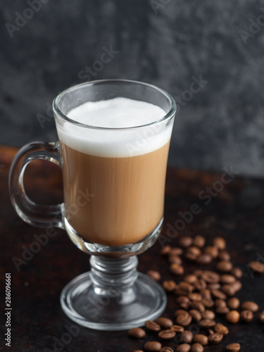 Coffee alcoholic or non-alcoholic cocktail on a dark background with roasted coffee beans