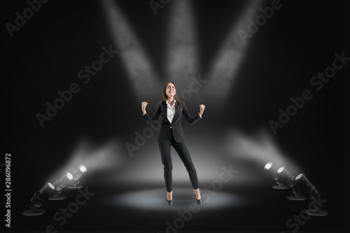 Fotografie Happy businesswoman on stage