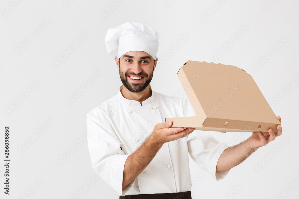 male chef holding a pizza box open Stock Photo