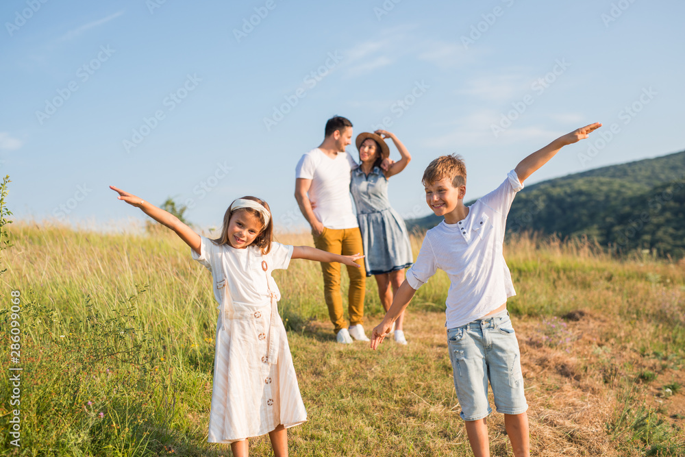 Happy family in nature. Happy family: mother, father, children son and daughter. life is made of little things. Happy family in nature. Happy family: mother, father, children son and daughter. life is made of little things.