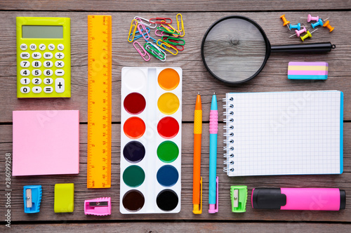 Back to school concept on grey wooden background, top view