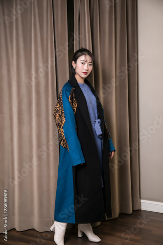 Portrait of Asian wealthy wife indoors