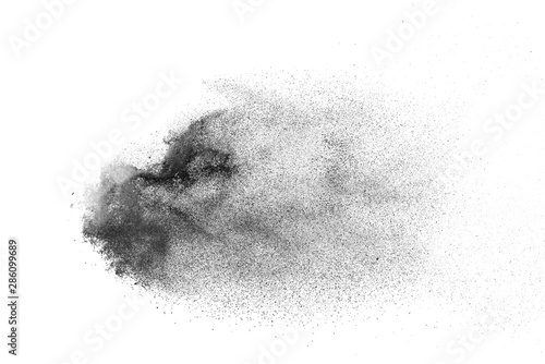 Abstract powder splatted background. Black powder explosion on white background. Colored cloud. Colorful dust explode. Paint Holi.
