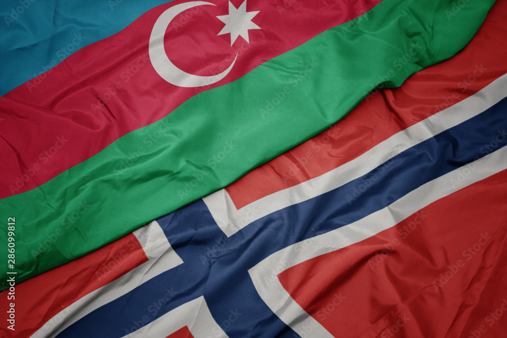 waving colorful flag of norway and national flag of azerbaijan.