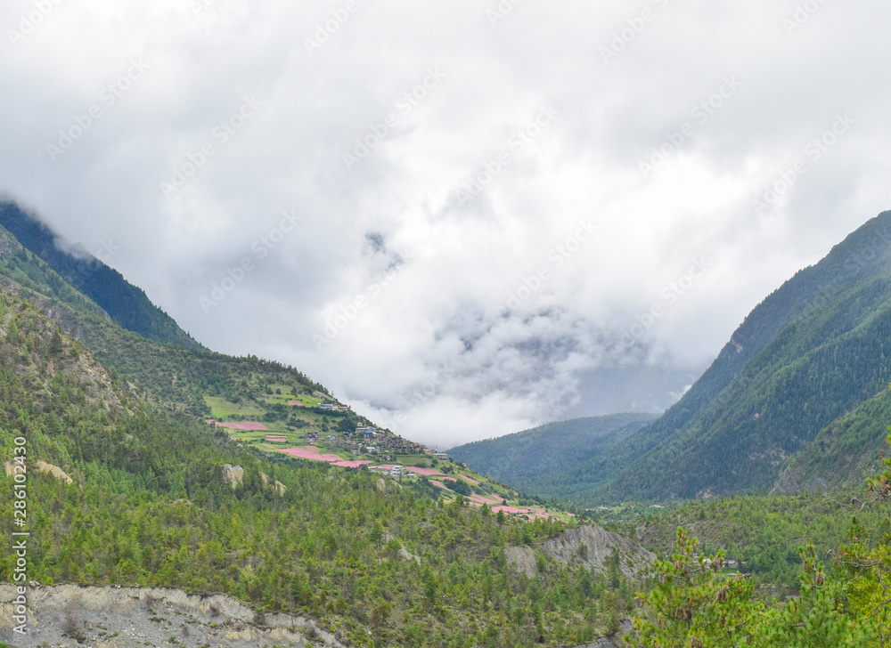 misty cloud and village on far end