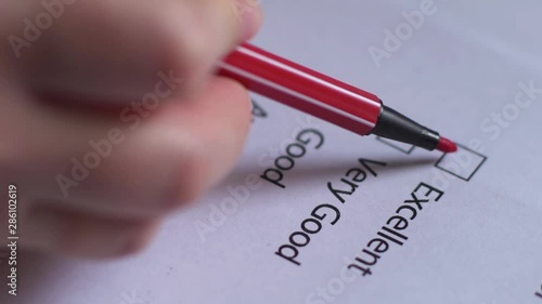 Cropped of businesswoman writing on checklist photo