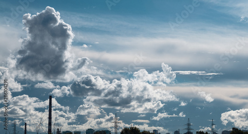 Dark thunderstorm and cirrus clouds in sky.