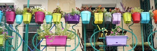 Photographie Colorful flowers and flowerpots variety beautiful terrace balcony house exterior