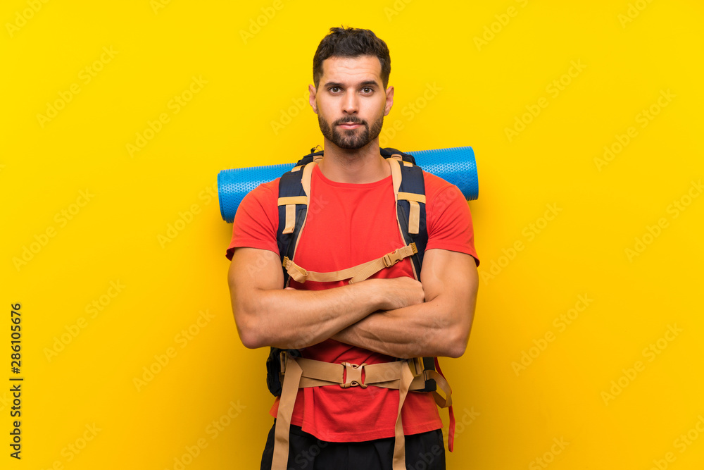 Young hiker man keeping arms crossed Young hiker man keeping arms crossed