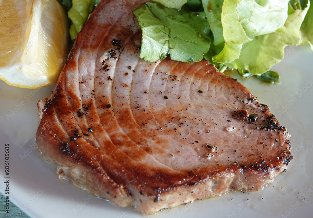 Tuna steak grilled sea food with lemon