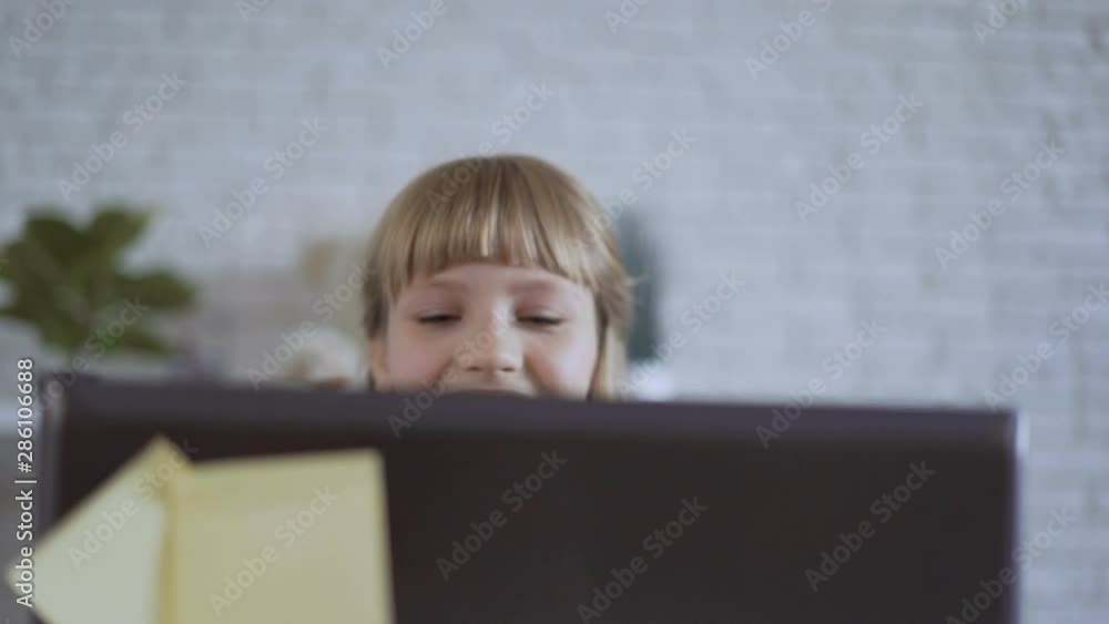 cute 10 years old girl is playing a computer game intently 4K cute 10 years old girl is playing a computer game intently 4K