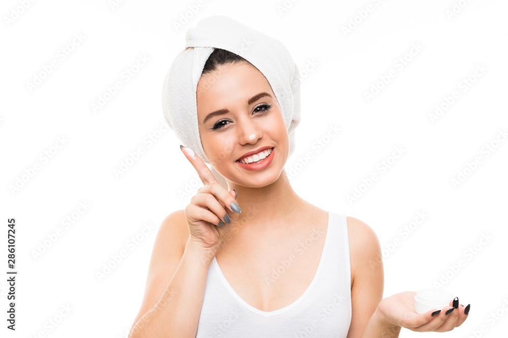 Young woman over isolated white background with moisturizer Young woman over isolated white background with moisturizer