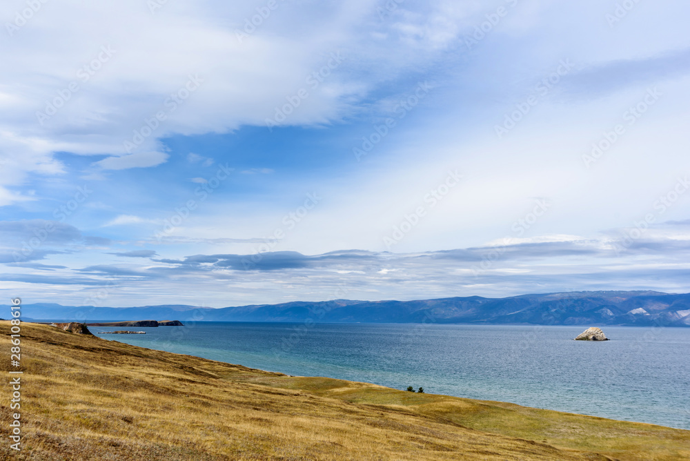Lake Baikal and mountains of Siberia with beautiful sky and clouds, Russia Oklhon island
