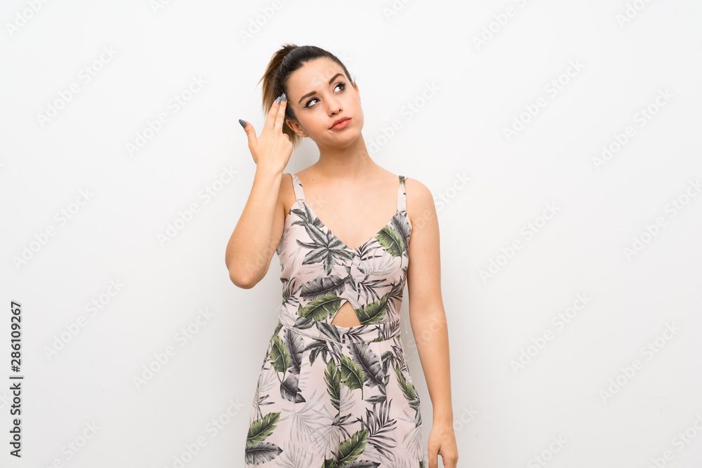 Young woman over isolated white background with problems making suicide gesture Young woman over isolated white background with problems making suicide gesture