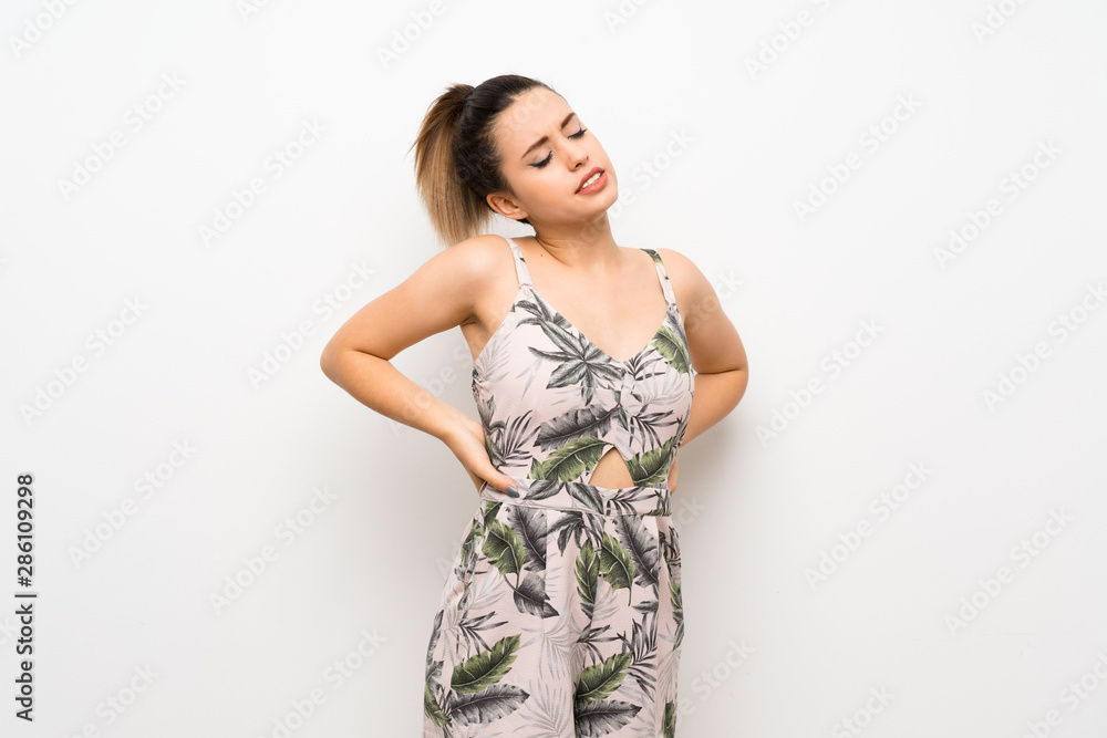 Young woman over isolated white background suffering from backache for having made an effort Young woman over isolated white background suffering from backache for having made an effort