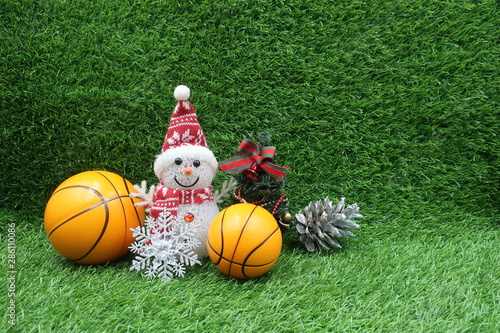 Basketball Christmas with basketball and Christmas ornament on green grass
