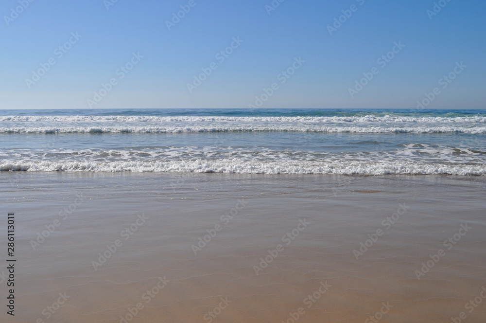 view of beach with sea and blue sky