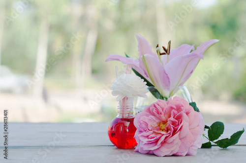 Fototapeta Naklejka Na Ścianę i Meble -  Beautiful pink lilies in white pots