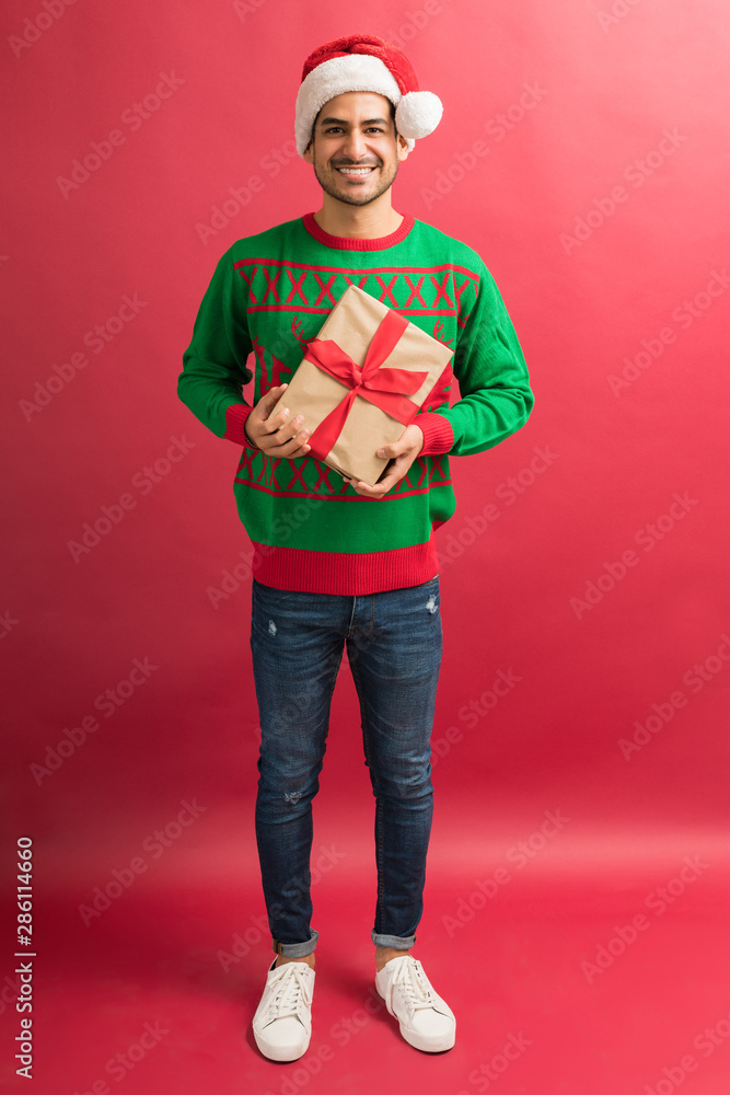 Happy Man With Gift Box Isolated In Studio Happy Man With Gift Box Isolated In Studio