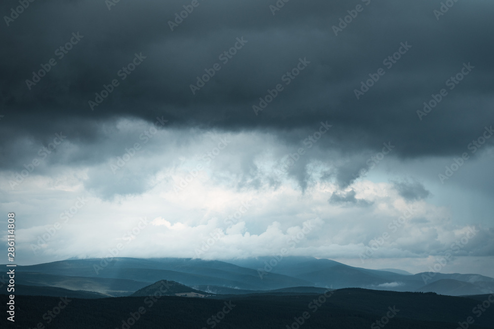 Dark stormy sky background in Jizera mountain, Czech republic